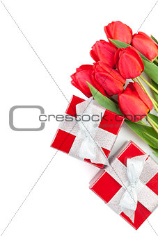 Fresh red tulips with gift boxes