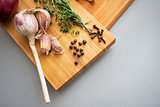 Closeup on pepper garlic and rosmarinus on cutting board