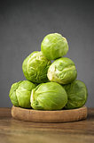 Fresh brussels sprouts on wooden table