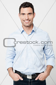 Handsome smiling man posing in casuals