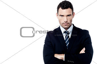 Angry businessman with crossed arms