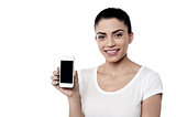 Young woman with blank smartphone screen