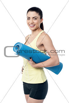 Beautiful woman with a yoga mat