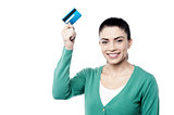 Attractive woman holding up cash card