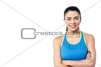 Young fit woman with arms folded