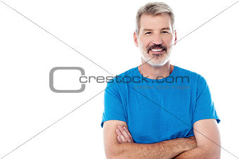 Casual man standing with his arms crossed