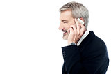 Businessman talking on phone over white