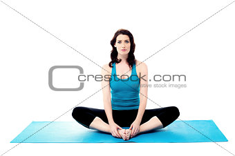 Woman stretching her leg to warm up