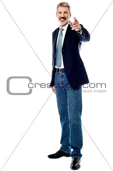 Senior businessman pointing to front