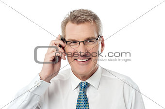 Happy businessman making a call