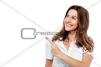 Happy smiling woman showing copyspace
