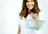 Smiling woman showing the shopping cart