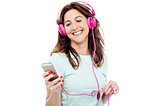 Middle aged woman enjoying listening music