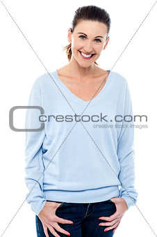 Middle aged woman with hands in pocket