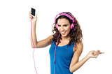 Preety woman listening to the music from smart phone