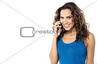 Smiling woman on phone, isolated over a white