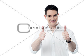 Successful man showing thumbs up gesture