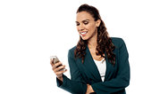 Businesswoman using smart phone on white