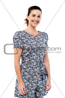 Casual middle aged woman posing over white