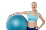 Young smiling woman with fitball