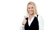 Happy business woman giving thumbs up