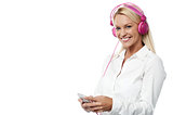 Woman with headphones and cell phone