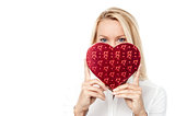Woman holds a heart shape to her face