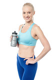 Fitness woman holding sipper bottle