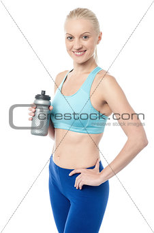 Fitness woman holding sipper bottle