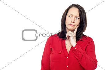 Thinking woman, isolated on white