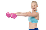 Young fitness woman with dumbbells