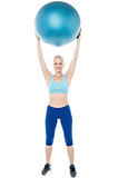 Woman exercising with gymnastic ball