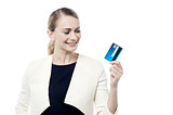 Happy woman holding credit card