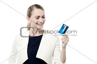 Happy woman holding credit card