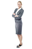 Smiling business woman, folded arms.