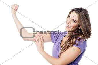 Beautiful charming girl flexing her biceps