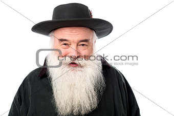 Senior male posing with hat