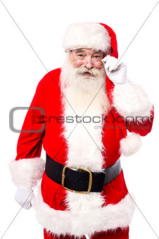 Santa Claus adjusting his spectacles