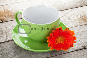 Coffee cup and gerbera