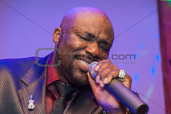 Black African male singing live