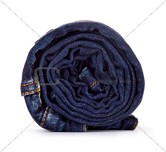 roll dark blue jeans on a white background