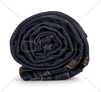roll dark blue jeans on a white background