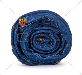 roll of blue jeans on a white background