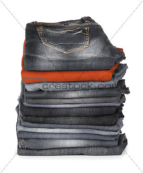 stack of jeans brown and black on a white background