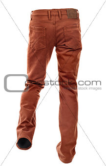Rear view of empty brown jeans on a white background