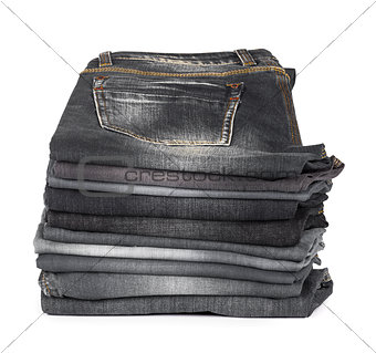stack of jeans gray and black on a white background