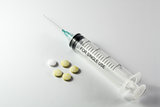 Syringe and tablets