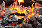 Horseshoe in the coals and flames