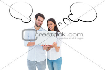 Composite image of attractive young couple holding their laptop