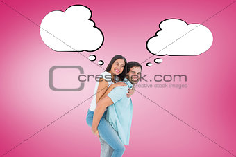 Composite image of happy casual man giving pretty girlfriend piggy back